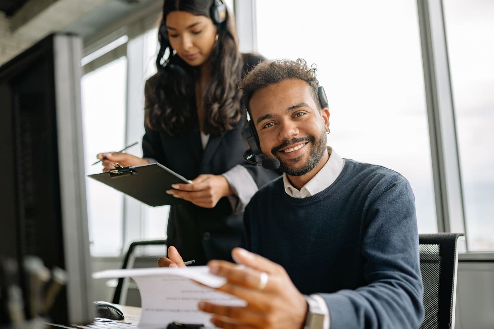 A client smiling while talking with his advisor