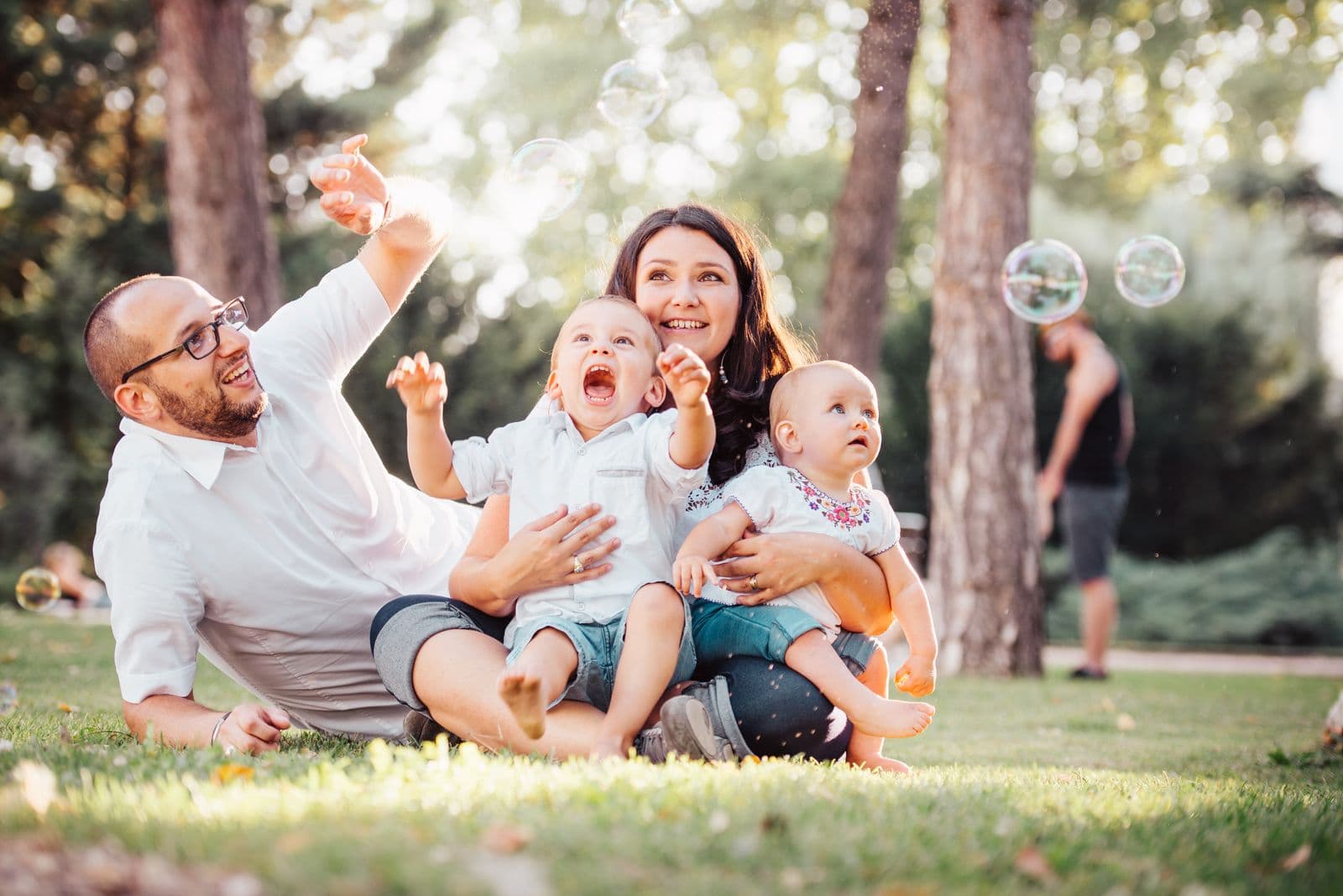 A happy American family playing together in the park